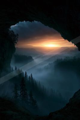 A night sky scene of sunrise, valley, mountains.