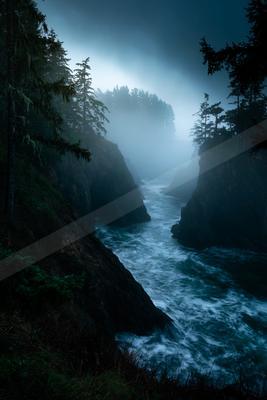 A blue hour long exposure water scene of river, ocean, storm.
