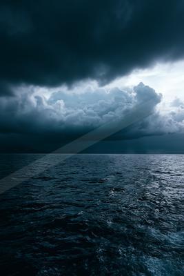 A dramatic sky scene of storm, ocean, clouds.