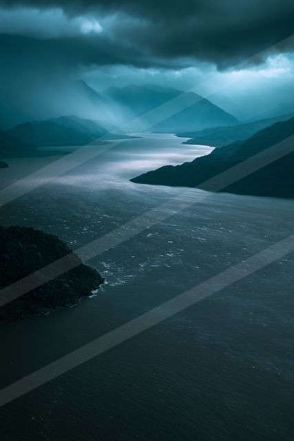 A night long exposure water scene of a lake, fog.