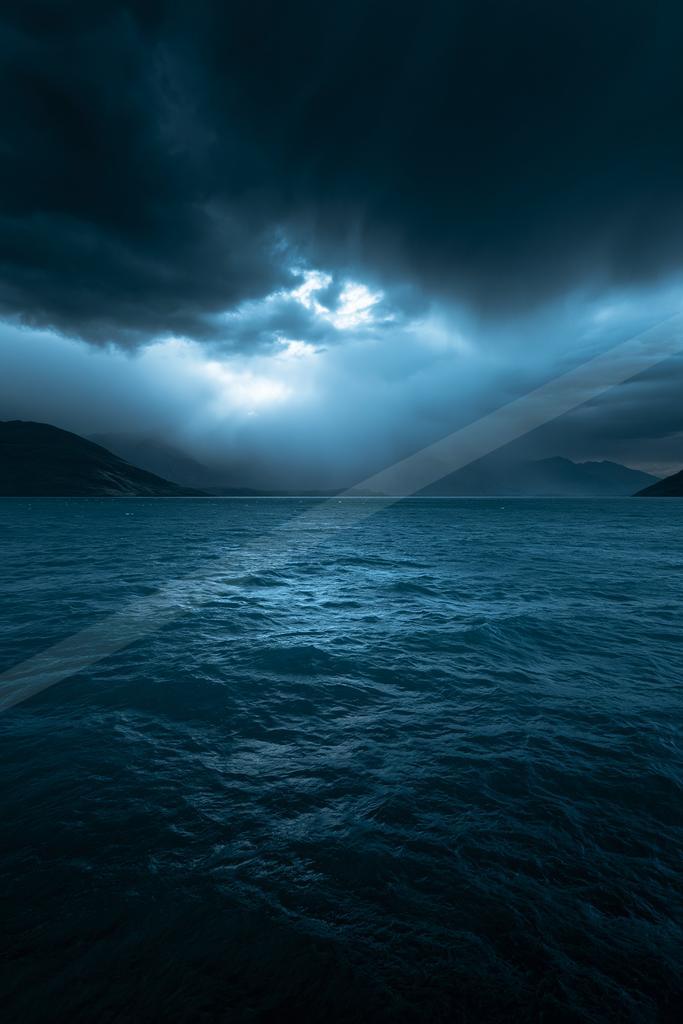 A blue hour long exposure water scene of ocean, storm.