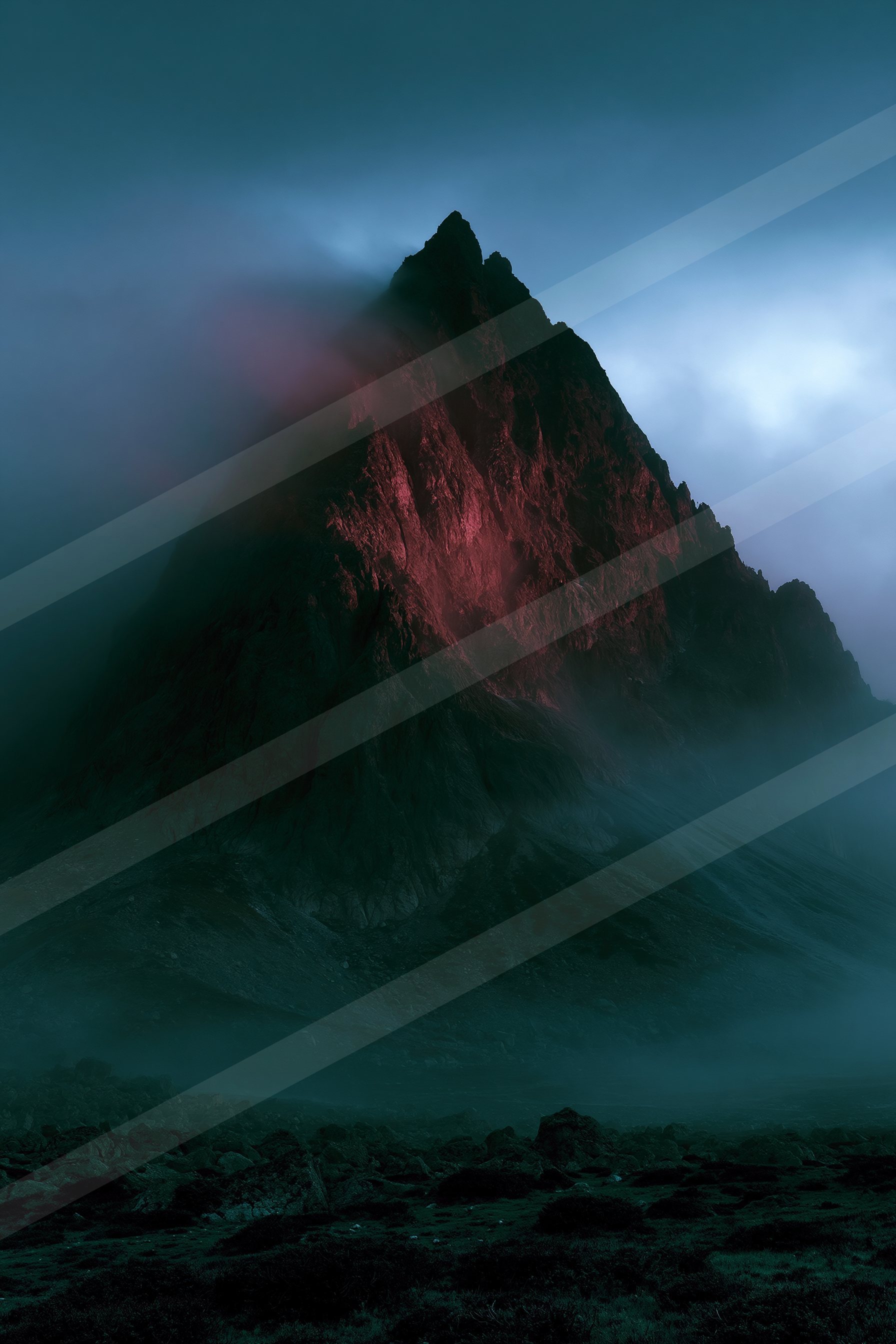 An ethereal landscape of a volcano, fog.