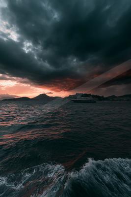 A dramatic sky scene of storm, ocean, clouds.