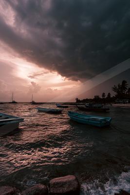 A blue hour long exposure sky scene of storm, ocean, clouds.