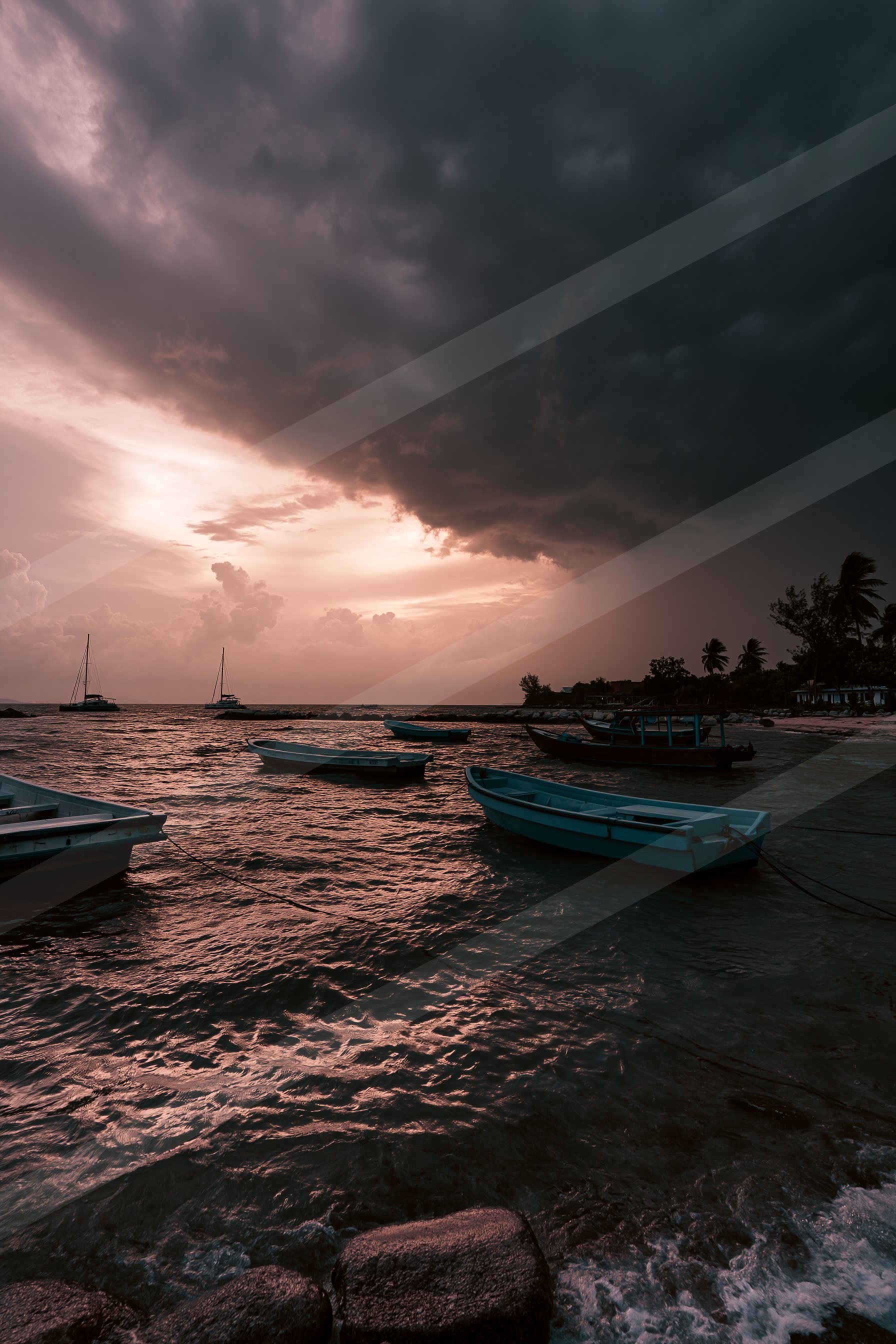 A blue hour long exposure water scene of a beach.