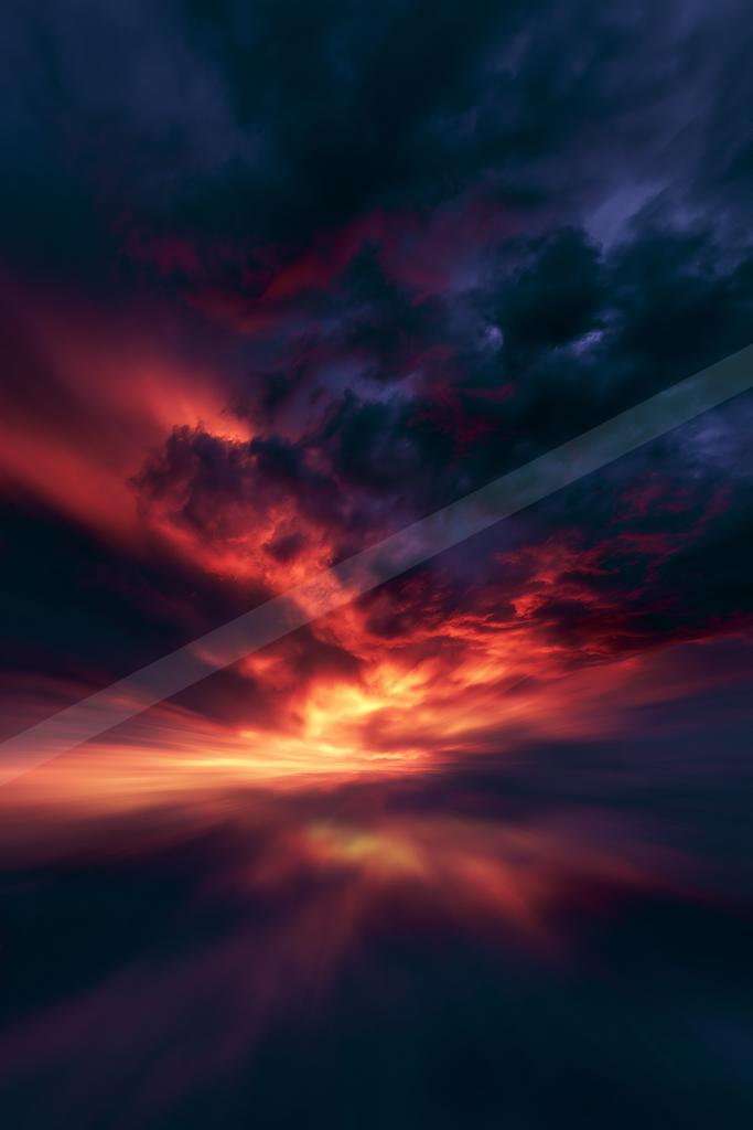 A dramatic long exposure sky scene of sunrise, clouds, sunset.