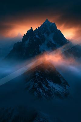 An ethereal double exposure landscape of a mountains, fog.