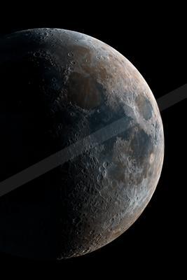 A detailed view of the moon's surface showing craters and rugged terrain against the blackness of space.