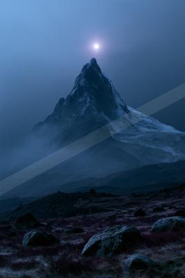 A moody landscape of mountains.