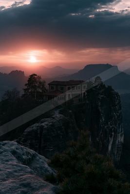 A moody landscape of mountains.