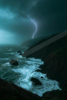 A powerful lightning bolt strikes near a rugged, forested cliff during a violent storm, illuminating the turbulent ocean waves crashing against dark rocks below