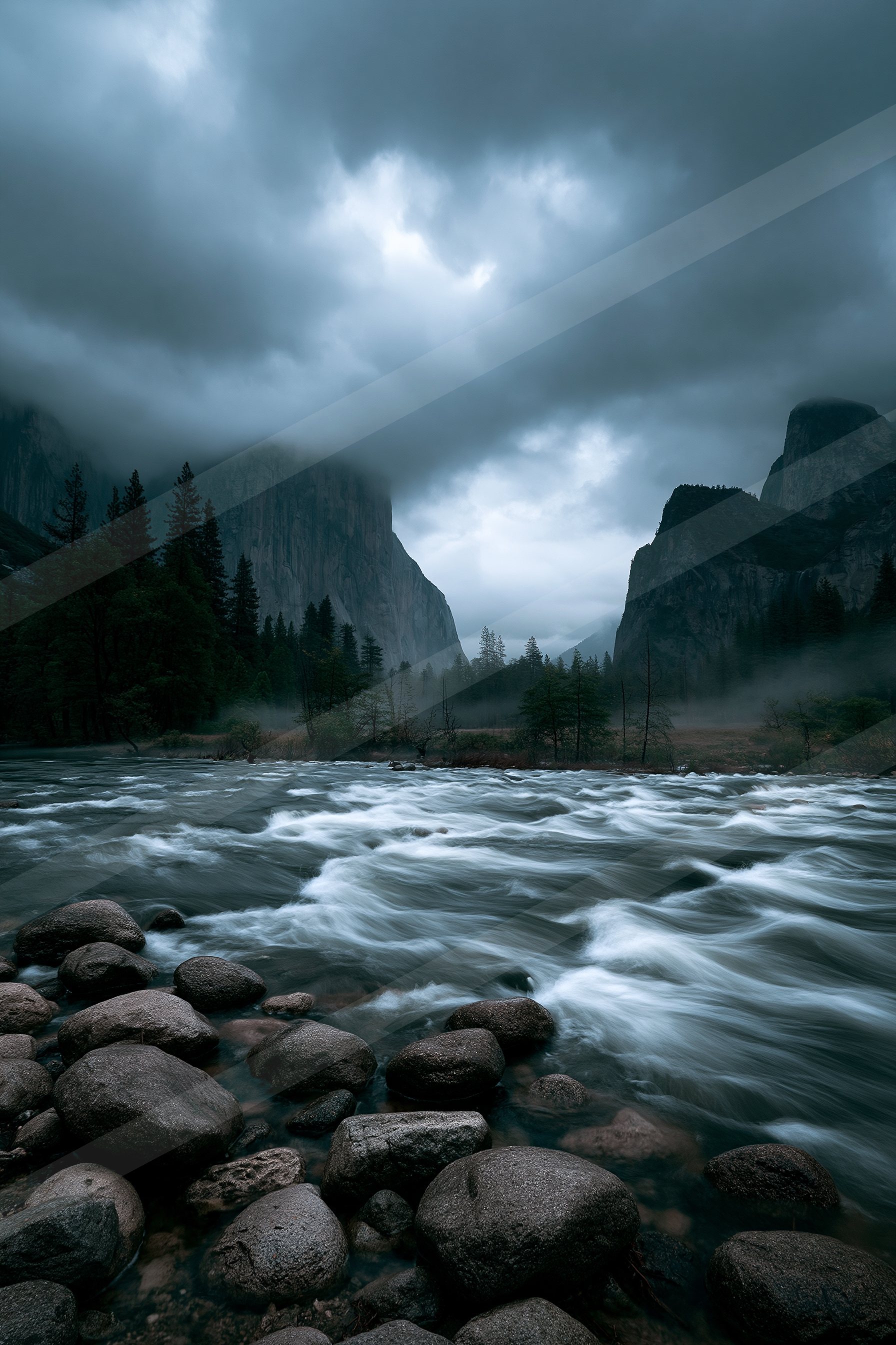 A dramatic long exposure water scene of a river, rocks.