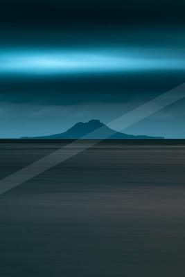 A blue hour long exposure landscape of a volcano, reflection.