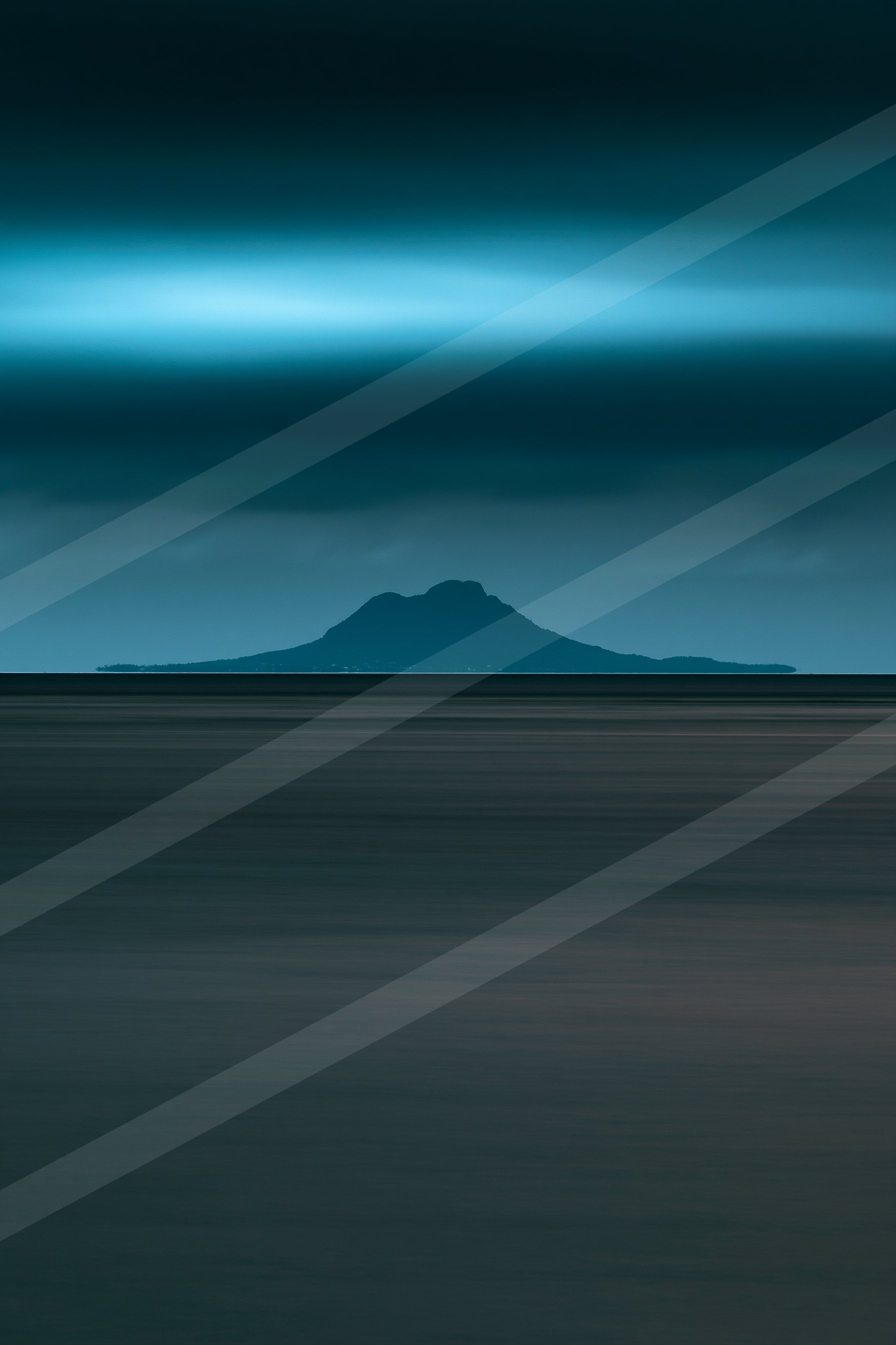 A blue hour long exposure landscape of a volcano, reflection.