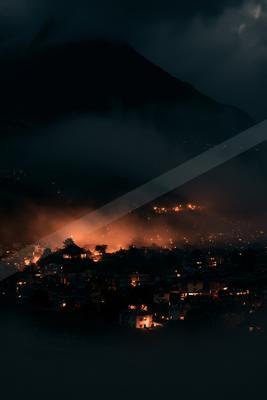 A black-toned moody photograph of volcano, alp, wing.