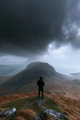 A dramatic sky scene of storm, mountains, clouds.