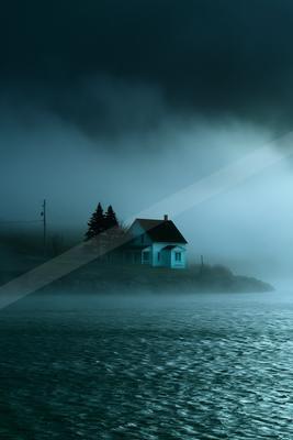 A blue hour sky scene of storm, ocean, fog.