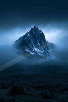 A night landscape of mountains, fog.