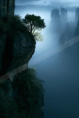 An ethereal double exposure landscape of a cliff, fog.