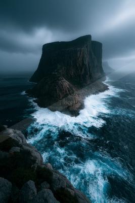 A mysterious long exposure landscape of a cliff, fog.